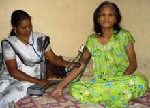 Woman getting her blood pressure taken